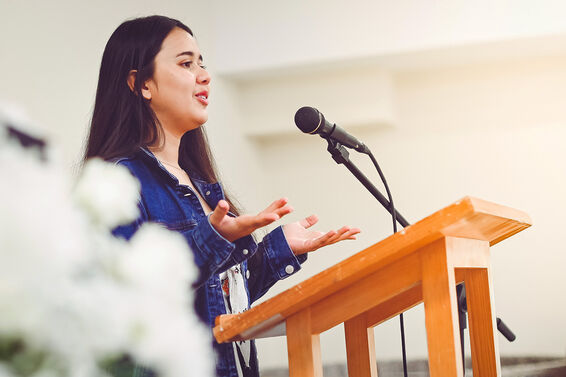 woman giving commemorative speech